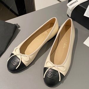 CHANEL Two-Tone Cream and Black Loafers